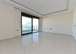 اول صف على البحر - شقة غرفتين وصالة طابق مرتفع -- مهموتلار / الانيا 