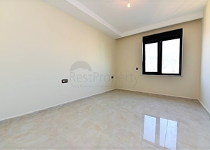 اول صف على البحر - شقة غرفتين وصالة طابق مرتفع -- مهموتلار / الانيا 