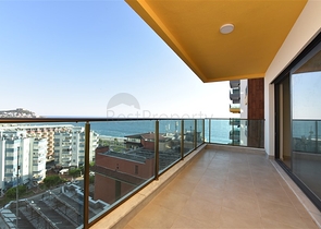 اول صف على البحر - شقة غرفتين وصالة طابق مرتفع -- مهموتلار / الانيا 