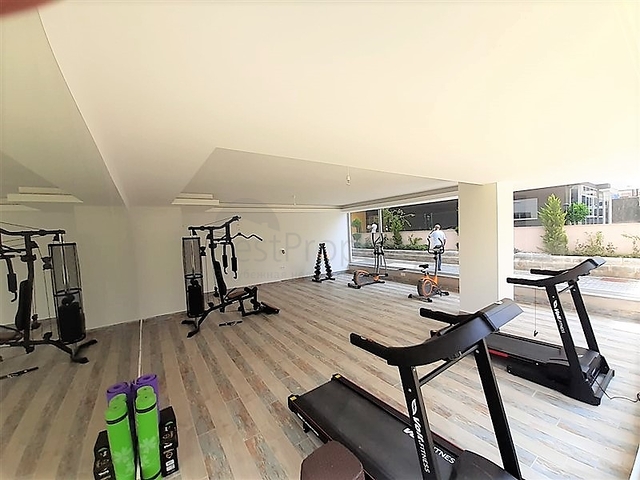 شقة جديدة -من تصميم 1+1 - مع الفرش -ضمن مجمع سكني قريب من البحر / مهموتلار /الانيا 