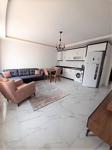 شقة جديدة -من تصميم 1+1 - مع الفرش -ضمن مجمع سكني قريب من البحر / مهموتلار /الانيا 