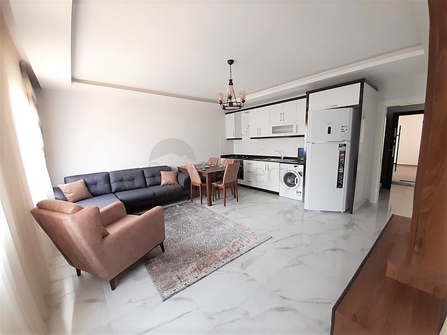 شقة جديدة -من تصميم 1+1 - مع الفرش -ضمن مجمع سكني قريب من البحر / مهموتلار /الانيا 