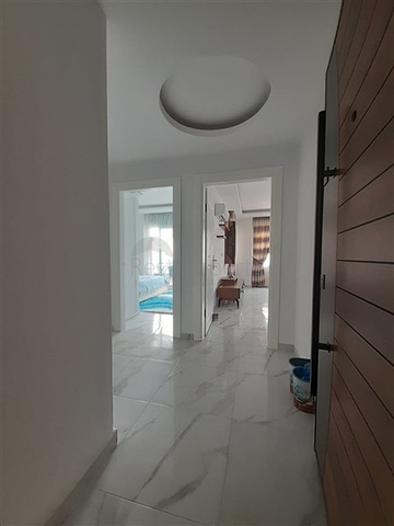 شقة جديدة -من تصميم 1+1 - مع الفرش -ضمن مجمع سكني قريب من البحر / مهموتلار /الانيا 