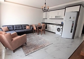 شقة جديدة -من تصميم 1+1 - مع الفرش -ضمن مجمع سكني قريب من البحر / مهموتلار /الانيا 