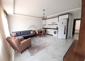 شقة جديدة -من تصميم 1+1 - مع الفرش -ضمن مجمع سكني قريب من البحر / مهموتلار /الانيا 