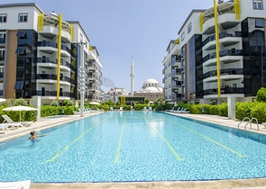 شقة بغرفة نوم واحدة مع أثاث في مشروع راقٍ في كونيالتي