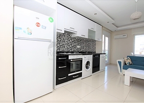 ضمن مجمع يضم خدمات - شقة مفروشة 1+1 - في منطقة توسمور المركزية / الانيا 