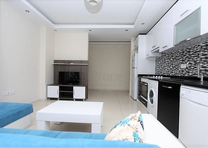 ضمن مجمع يضم خدمات - شقة مفروشة 1+1 - في منطقة توسمور المركزية / الانيا 