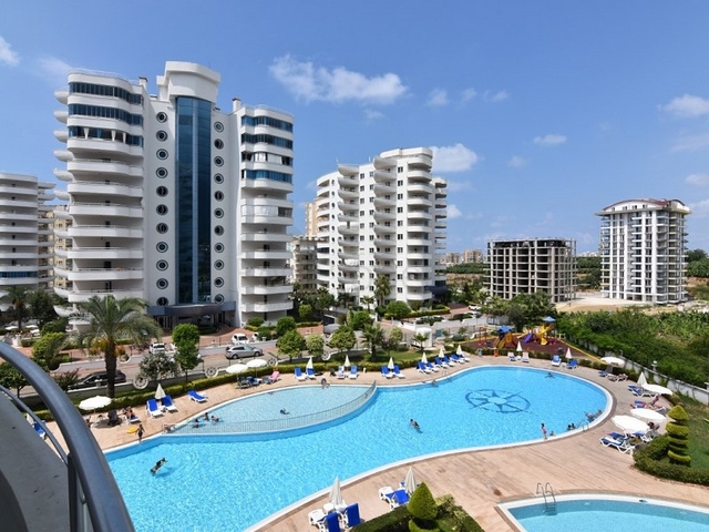 اطلالة على المسبح - شقة 2 غرفة وصالة - ضمن مجمع يضم كافة الخدمات - مهموتلار / الانيا 