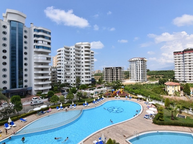 اطلالة على المسبح - شقة 2 غرفة وصالة - ضمن مجمع يضم كافة الخدمات - مهموتلار / الانيا 