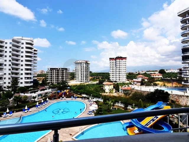 اطلالة على المسبح - شقة 2 غرفة وصالة - ضمن مجمع يضم كافة الخدمات - مهموتلار / الانيا 