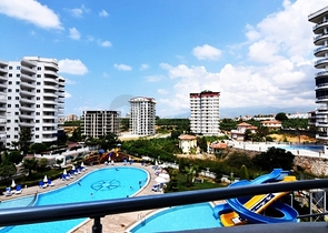 اطلالة على المسبح - شقة 2 غرفة وصالة - ضمن مجمع يضم كافة الخدمات - مهموتلار / الانيا 