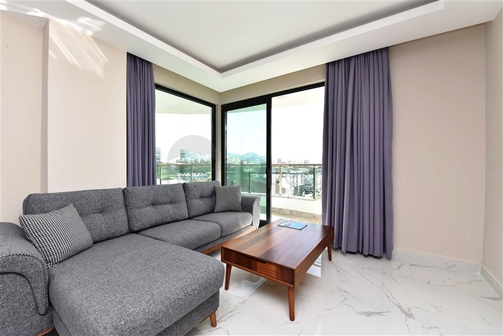 طابق مرتفع - مجمع سكني حديث - شقة 1+1 غرفة نوم وصالة - في مهموتلار / الانيا 