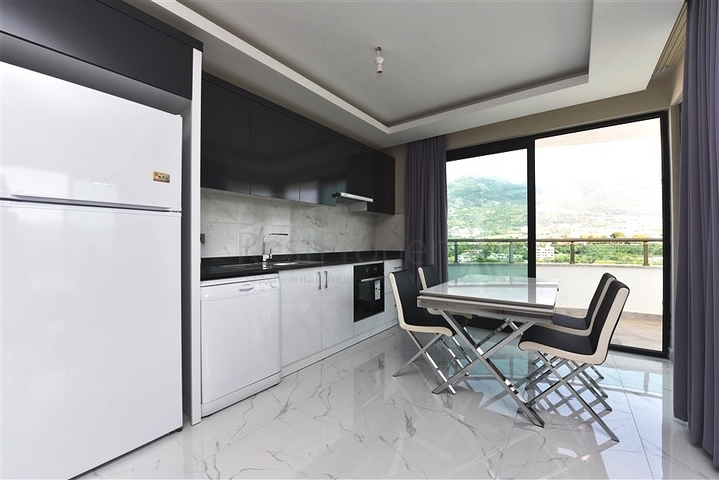 طابق مرتفع - مجمع سكني حديث - شقة 1+1 غرفة نوم وصالة - في مهموتلار / الانيا 