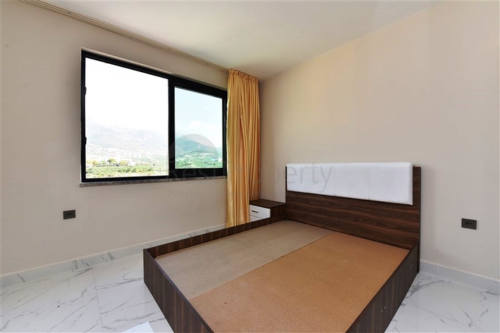 طابق مرتفع - مجمع سكني حديث - شقة 1+1 غرفة نوم وصالة - في مهموتلار / الانيا 