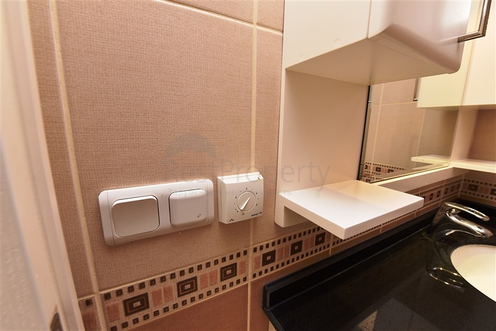 على البحر مباشرة - شقق عائلية 2 غرفة وصالة -في مدينة الانيا / منطقة ديمرتاش 