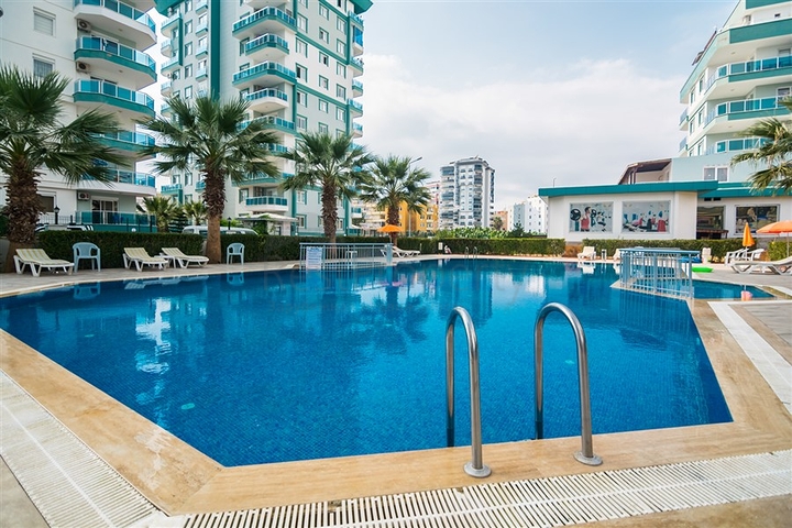 بسعر مناسب - شقة مؤثثة من تصميم 1+2 غرفتين وصالة - ضمن مجمع سكني - في مهموتلار / الانيا 