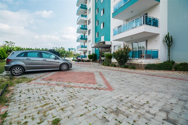 بسعر مناسب - شقة مؤثثة من تصميم 1+2 غرفتين وصالة - ضمن مجمع سكني - في مهموتلار / الانيا 