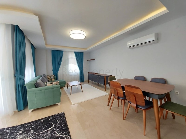 بسعر مناسب - شقة مؤثثة من تصميم 1+2 غرفتين وصالة - ضمن مجمع سكني - في مهموتلار / الانيا 