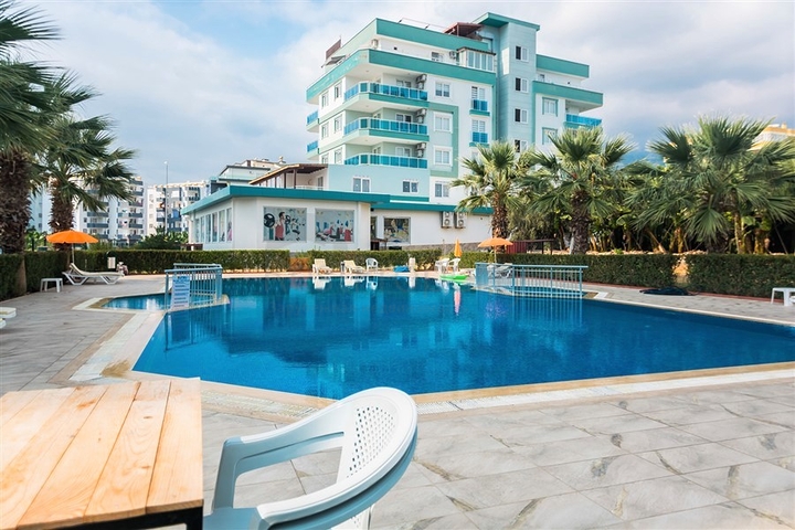 بسعر مناسب - شقة مؤثثة من تصميم 1+2 غرفتين وصالة - ضمن مجمع سكني - في مهموتلار / الانيا 