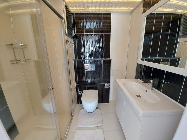 بسعر مناسب - شقة مؤثثة من تصميم 1+2 غرفتين وصالة - ضمن مجمع سكني - في مهموتلار / الانيا 