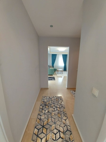 بسعر مناسب - شقة مؤثثة من تصميم 1+2 غرفتين وصالة - ضمن مجمع سكني - في مهموتلار / الانيا 