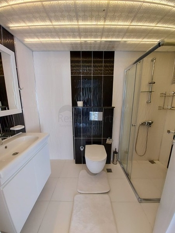 بسعر مناسب - شقة مؤثثة من تصميم 1+2 غرفتين وصالة - ضمن مجمع سكني - في مهموتلار / الانيا 