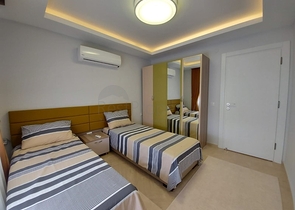 بسعر مناسب - شقة مؤثثة من تصميم 1+2 غرفتين وصالة - ضمن مجمع سكني - في مهموتلار / الانيا 