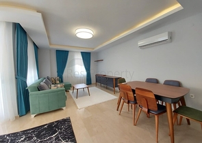 بسعر مناسب - شقة مؤثثة من تصميم 1+2 غرفتين وصالة - ضمن مجمع سكني - في مهموتلار / الانيا 