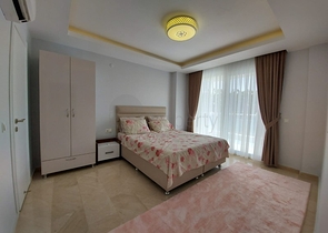 بسعر مناسب - شقة مؤثثة من تصميم 1+2 غرفتين وصالة - ضمن مجمع سكني - في مهموتلار / الانيا 