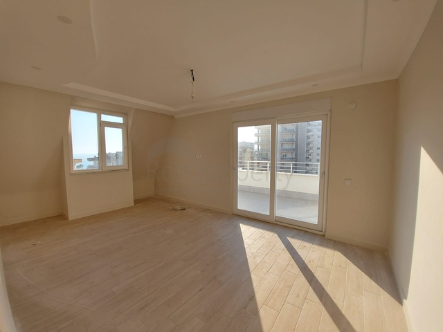 قريبة من البحر والمركز - شقة غرفتين وصالة -بدون فرش - في مهموتلار / الانيا 