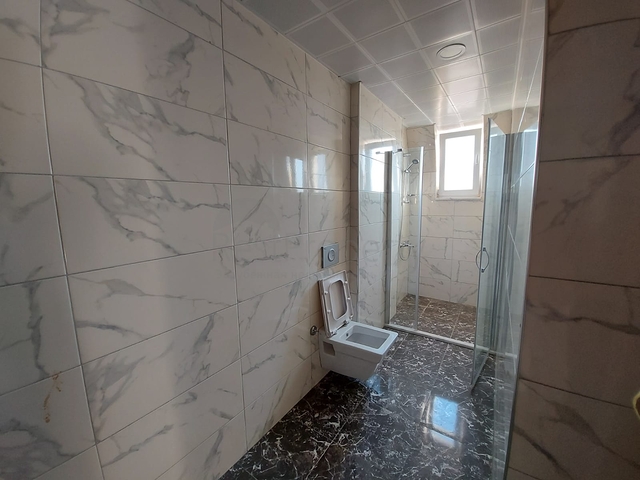 قريبة من البحر والمركز - شقة غرفتين وصالة -بدون فرش - في مهموتلار / الانيا 