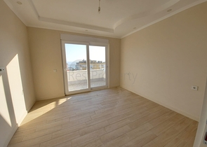 قريبة من البحر والمركز - شقة غرفتين وصالة -بدون فرش - في مهموتلار / الانيا 