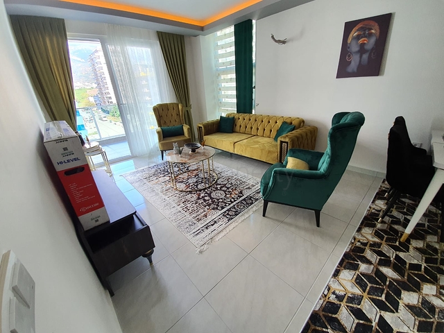 شقة فاخرة - مؤثثة - تصميم 1+1 - ضمن مجمع فاخر قريب من البحر - في مهموتلار / الانيا 