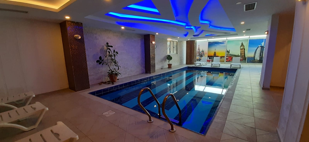 على البحر مباشرة - شقة فاخرة - تصميم غرفتين وصالة - مجمع فاخر - في مهموتلار / الانيا 