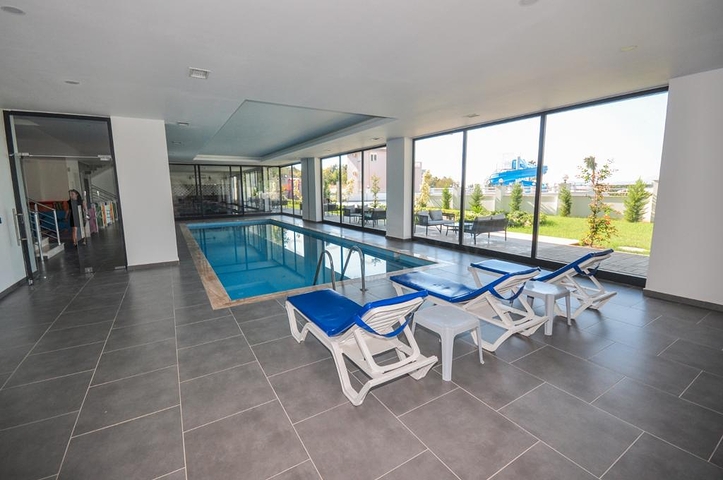 اطلالة جبلية خضراء - شقة غرفة وصالة مفروشة - ضمن مجمع سكني حديث - في مهموتلار / الانيا 