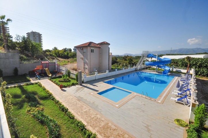 اطلالة جبلية خضراء - شقة غرفة وصالة مفروشة - ضمن مجمع سكني حديث - في مهموتلار / الانيا 