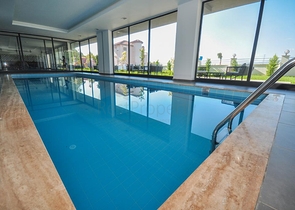 اطلالة جبلية خضراء - شقة غرفة وصالة مفروشة - ضمن مجمع سكني حديث - في مهموتلار / الانيا 