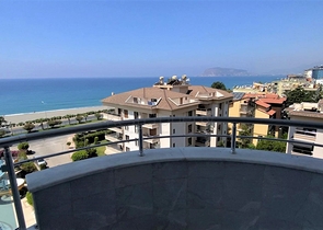 اطلالة بحرية ساحرة -طابق مرتفع - شقة غرفتين وصالة ضمن مجمع اول صف على البحر - في توسمور / الانيا