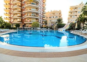 اطلالة بحر - شقة غرفتين وصالة مفروشة - ضمن مجمع في اول صف عالبحر - في مهموتلار / الانيا 