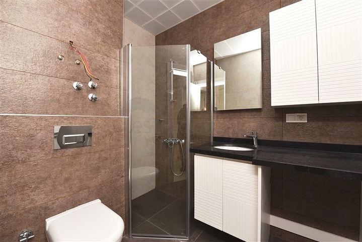 شقة غرفة وصالة -ضمن محمع سكني حديث -في مهموتلار / الانيا 