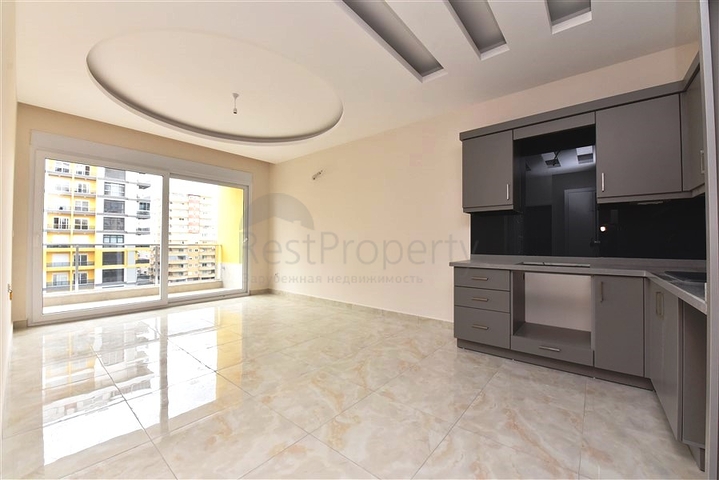 شقة غرفة وصالة -ضمن محمع سكني حديث -في مهموتلار / الانيا 