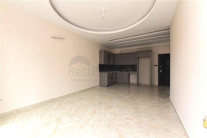 شقة غرفة وصالة -ضمن محمع سكني حديث -في مهموتلار / الانيا 