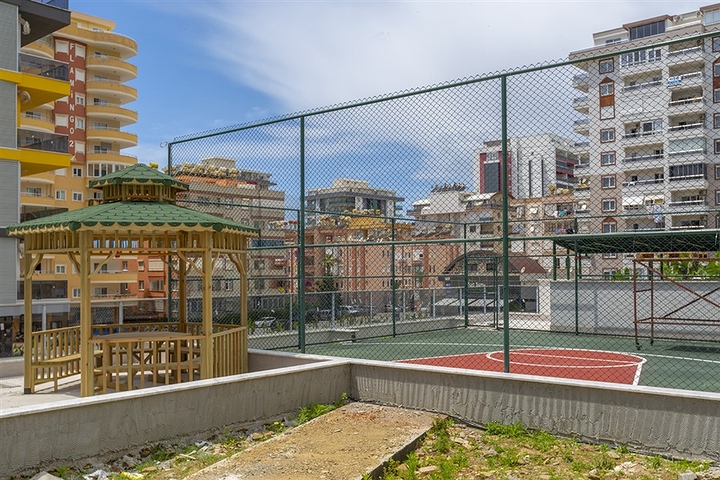 شقة غرفة وصالة -ضمن محمع سكني حديث -في مهموتلار / الانيا 