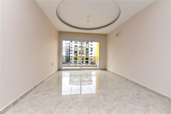 شقة غرفة وصالة -ضمن محمع سكني حديث -في مهموتلار / الانيا 