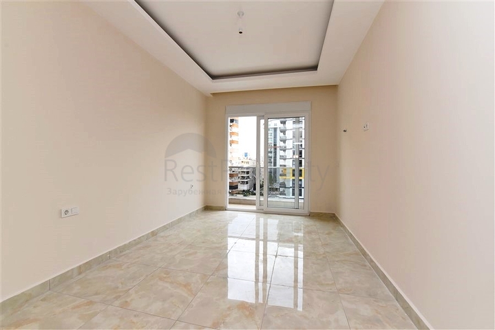 شقة غرفة وصالة -ضمن محمع سكني حديث -في مهموتلار / الانيا 