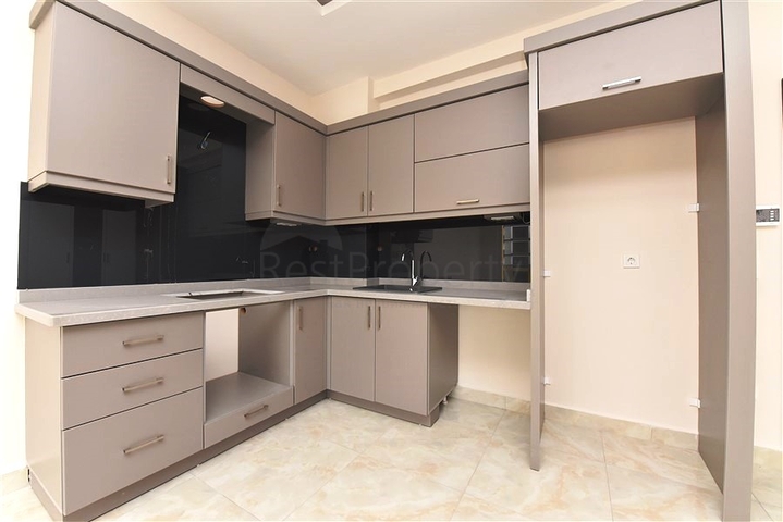 شقة غرفة وصالة -ضمن محمع سكني حديث -في مهموتلار / الانيا 