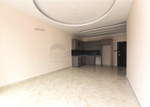 شقة غرفة وصالة -ضمن محمع سكني حديث -في مهموتلار / الانيا 