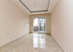 شقة غرفة وصالة -ضمن محمع سكني حديث -في مهموتلار / الانيا 