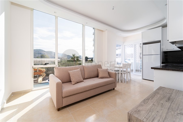 شقة غرفة وصالة - مجمع سكني حديث - قريب من الاسواق والبحر - في مهموتلار / الانيا 